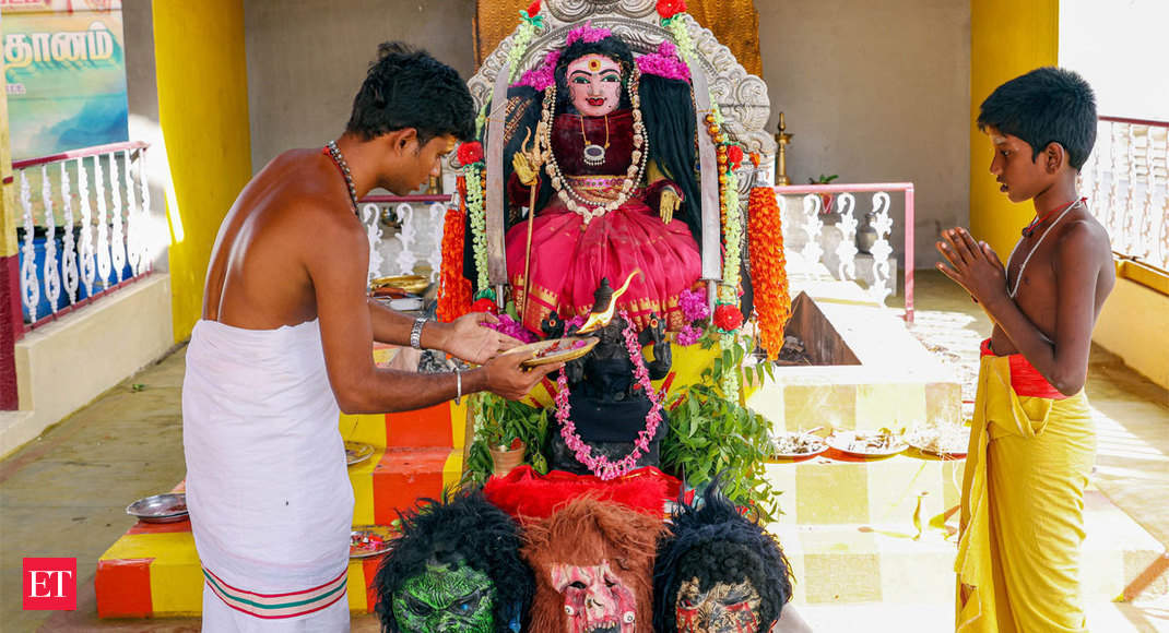 Priests in India pray for mercy from coronavirus 'Goddess' - Corona Devi | The Economic Times