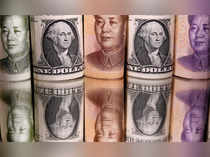 FILE PHOTO: Chinese Yuan and U.S. dollar banknotes are seen in this illustration