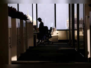 FILE PHOTO: An employee of software company Nuix stands in their office located in central Sydney, Australia