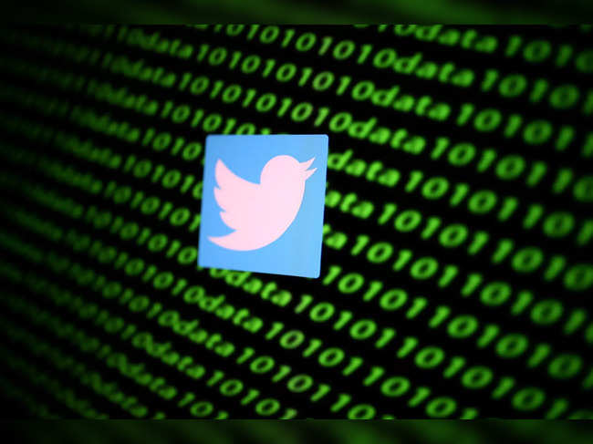 FILE PHOTO: The Twitter logo and binary cyber codes are seen in this illustration