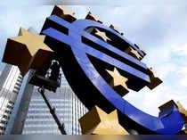 FILE PHOTO: Workers maintain the huge Euro logo in front headquarters of ECB in Frankfurt