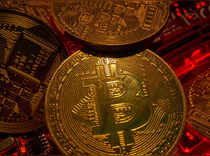FILE PHOTO: Representations of the virtual currency Bitcoin stand on a motherboard in this picture illustration