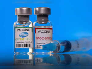Vials with Pfizer-BioNTech and Moderna COVID-19 vaccine labels