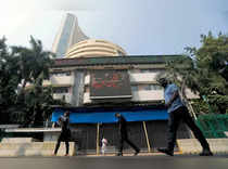 People walk past the Bombay Stock Exchange (BSE) building in Mumbai