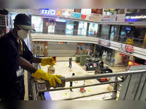 Kolkata: A worker sanitizes Lake Mall ahead of its re-opening after certain rest...