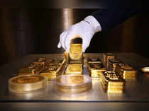 FILE PHOTO: Gold bars and coins are stacked in the safe deposit boxes room of the Pro Aurum gold house in Munich