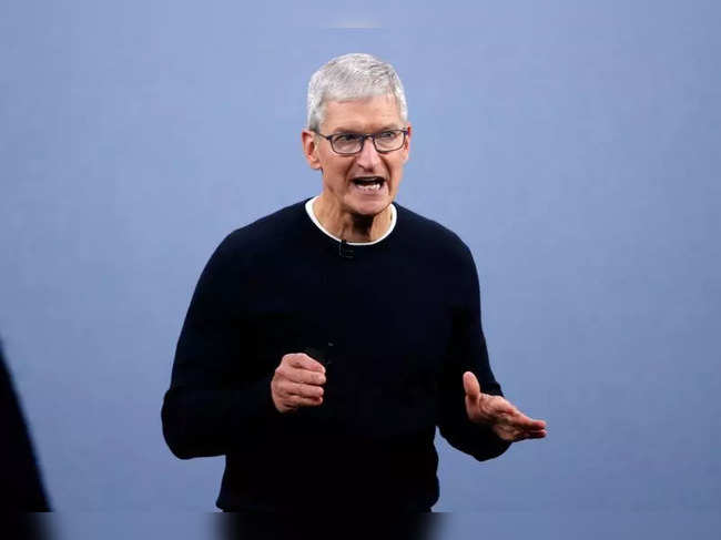 FILE PHOTO: CEO Tim Cook speaks at an Apple event at their headquarters in Cupertino
