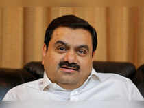 FILE PHOTO: Indian billionaire Adani speaks during an interview with Reuters at his office in Ahmedabad
