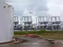 FILE PHOTO: An oil storage tank and crude oil pipeline equipment is seen during a tour by the Department of Energy at the Strategic Petroleum Reserve in Freeport