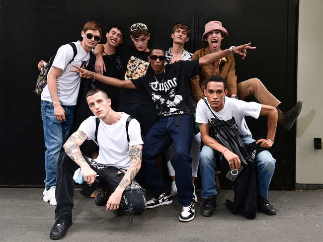 Models pose after the Dolce and Gabbana men's Spring-Summer 2022 fashion collection show in Milan, on June 19, 2021.