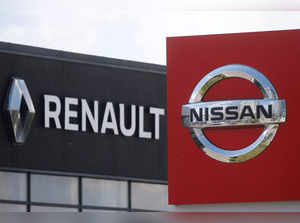 FILE PHOTO: The logos of car manufacturers Nissan and Renault are pictured at a dealership Kyiv