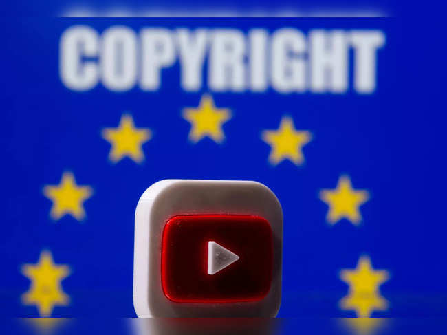 A 3D printed Youtube logo is seen in front of a displayed EU flag and copyright words in this illustration picture