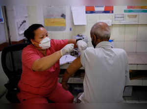 Kailash Nath, 69, receives a dose of COVISHIELD vaccine, a coronavirus disease (COVID-19) vaccine, manufactured by Serum Insitutue of India, at a hospital, in New Delhi