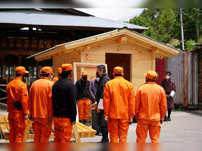 Bhutan's King Jigme Khesar Namgyel Wangchuck visits a group of Desuups training at Carpentry Edelweiss during his visit to remote villages to oversee measures to contain the spread of the coronavirus disease (COVID-19) in Bumthang