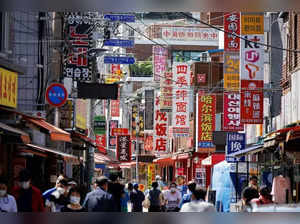 Residents walk at a China town in Seoul