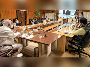 Karnataka Chief Minister B S Yediyurappa (L) holds a meeting with rep...