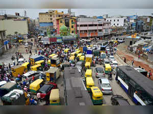 Commuters stuck in a traffic jam at Bengaluru market area