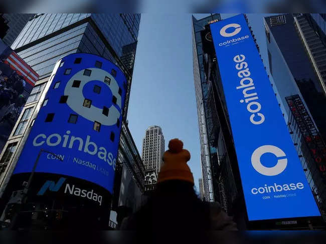 The logo for Coinbase Global Inc is displayed on the Nasdaq MarketSite jumbotron and others at Times Square in New York