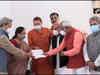 CM-designate Pushkar Singh Dhami meets Uttarakhand Governor Baby Rani Maurya at her residence in Dehradun