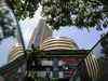 Sensex ends 13 points lower, Nifty below 15,700; cement stocks rally