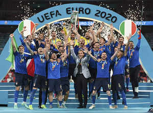 London: Italy's team celebrates with the trophy on the podium after winning the ...