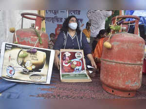 Kolkata: TMC activists with posters and cylinders protest against fuel and LPG p...
