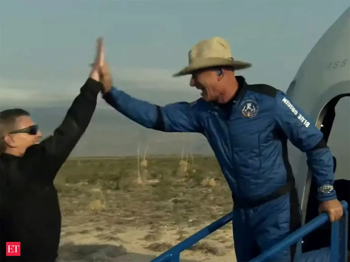 Ecstatic Jeff Bezos lands on Earth after becoming 2nd billionaire to ...