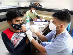 Gurugram: A health worker administers a dose of Sputnik V coronavirus vaccine to...