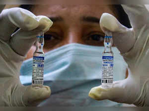 Gurugram: A health worker shows vials of the Sputnik V coronavirus vaccine, in G...