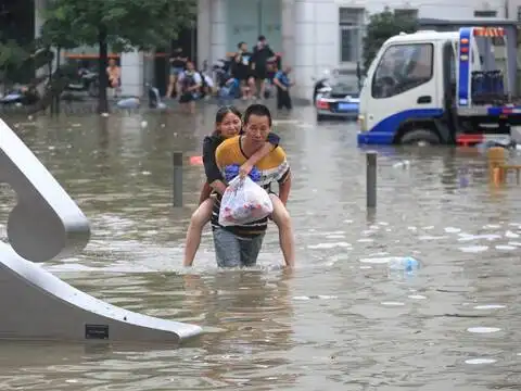 A man carrying a woman