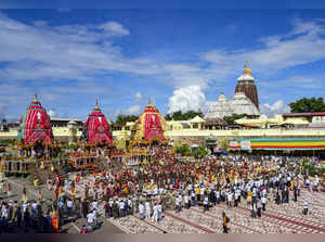 Puri: Devotees perform rituals during the annual Rath Yatra festival in Puri. (P...