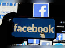 Facebook logo is displayed on a mobile phone