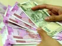 Rupee surges 13 paise to 74.25 against US dollar