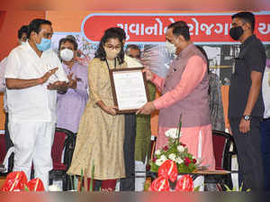 Surat: Gujarat CM Vijay Rupani during an event of 'Employment Day', at SIECC in ...