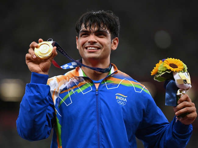 Gold medalist Neeraj Chopra of Team India stands on the podium during the medals ceremony for the Men's Javelin Throw on day fifteen of the Tokyo 2020 Olympic Games at Olympic Stadium on August 07, 2021 in Tokyo, Japan.