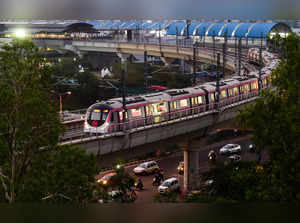 New Delhi: A metro train leaves from Anand Vihar station after the resumption of...