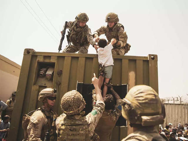 US Marine lifting baby during evacuation