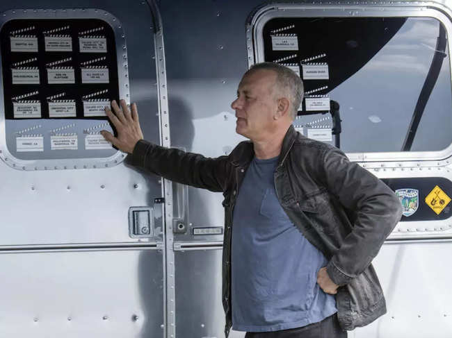 An undated photo provided by the auction house Bonhams shows the actor Tom Hanks with his Airstream 34-foot travel trailer.