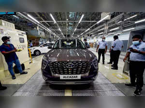 Chennai: Workers busy on the assembly line at Hyundai' Sriperumbudur facility, n...