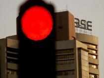 Sensex off record high, ends 214 pts lower; Nifty below 17,100; M&M sheds 3%