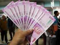 Rupee drops 11 paise to close at 74.35 against dollar