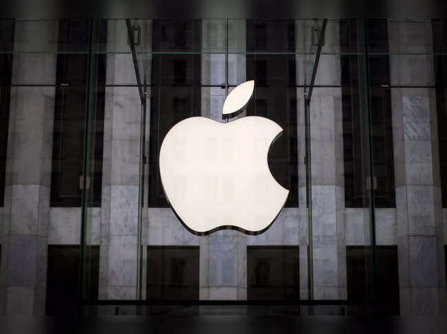 FILE PHOTO: An Apple logo hangs above the entrance to the Apple store on 5th Avenue in the Manhattan borough of New York City
