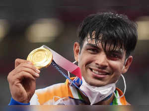 Tokyo: India's Neeraj Chopra holds the gold medal at the podium during the medal...