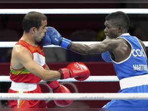 Tokyo: India's Amit Panghal takes a punch from Colombia's Yuberjen Martinez in t...