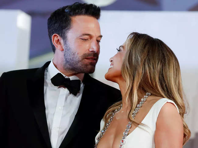 ​Jennifer Lopez​ was dripping in Cartier diamonds in a white mermaid body hugging gown by Georges Hobeika, and Ben Affleck looked dapper in a black Dolce & Gabbana tuxedo.