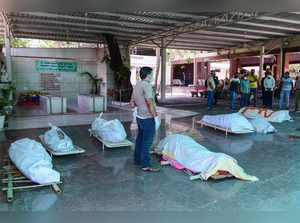 Bodies of COVID-19 victims, at a crematorium, in New Delhi. (PTI Phot...