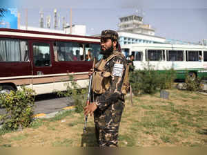 A member of Taliban security forces stands guard at the international airport in Kabul