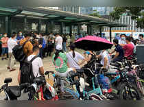 People protest to demand repayment of loans and financial products at the Evergrande's headquarters in Shenzhen