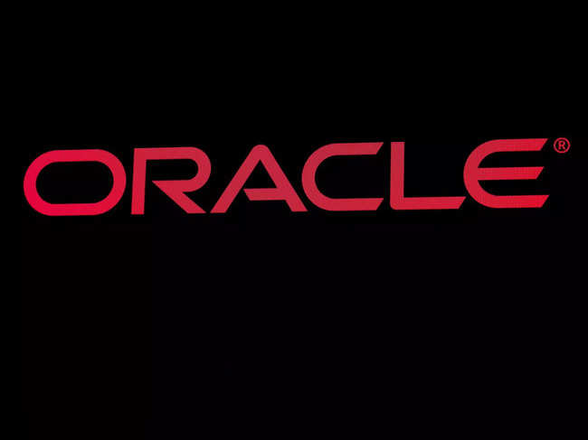 FILE PHOTO: The company logo for Oracle Corp. is displayed on a screen on the floor at the NYSE in New York