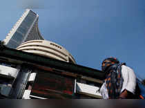 A woman walks past the Bombay Stock Exchange building in Mumbai
